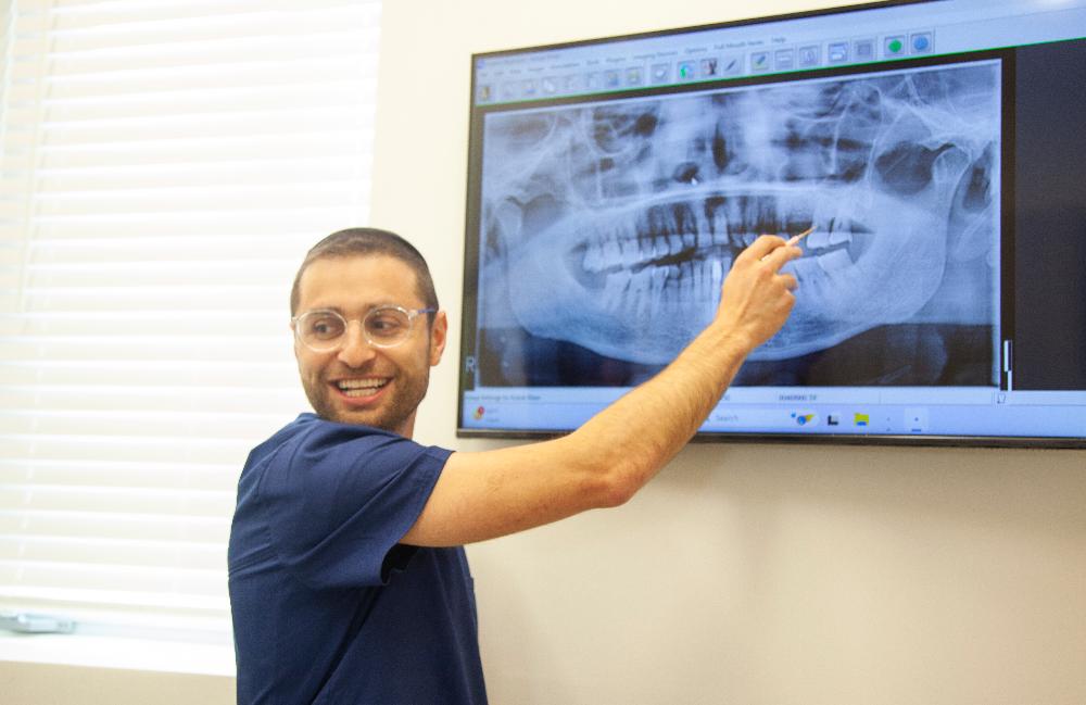 dr eli with digital x-ray | dentist teaneck new jersey