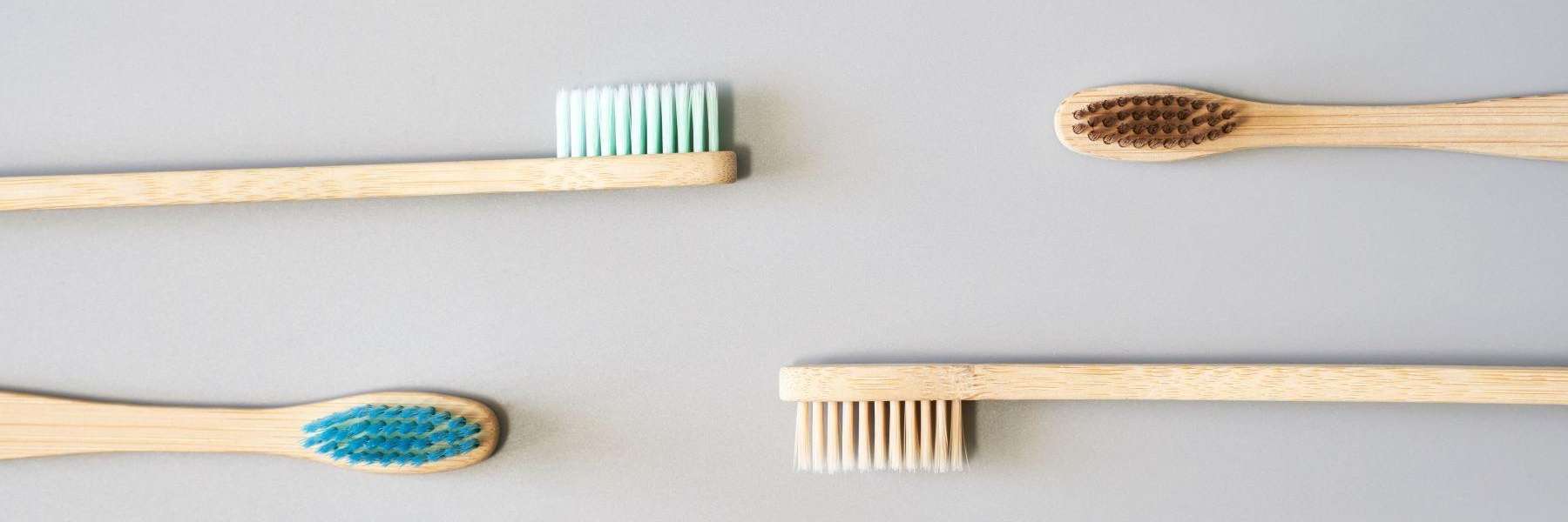 four wooden toothbrushes | emergency dentist teaneck nj
