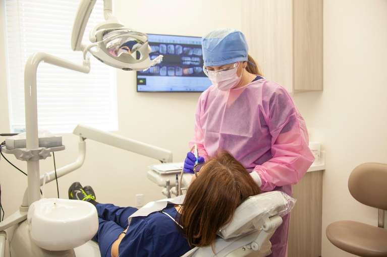 dental hygentist with patient | dentist teaneck