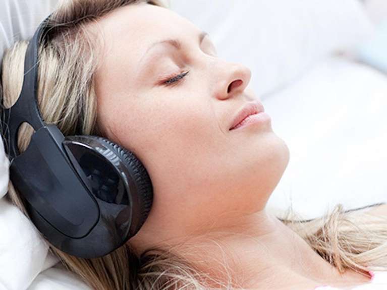 patient wearing noise cancelling headphones | dentist teaneck